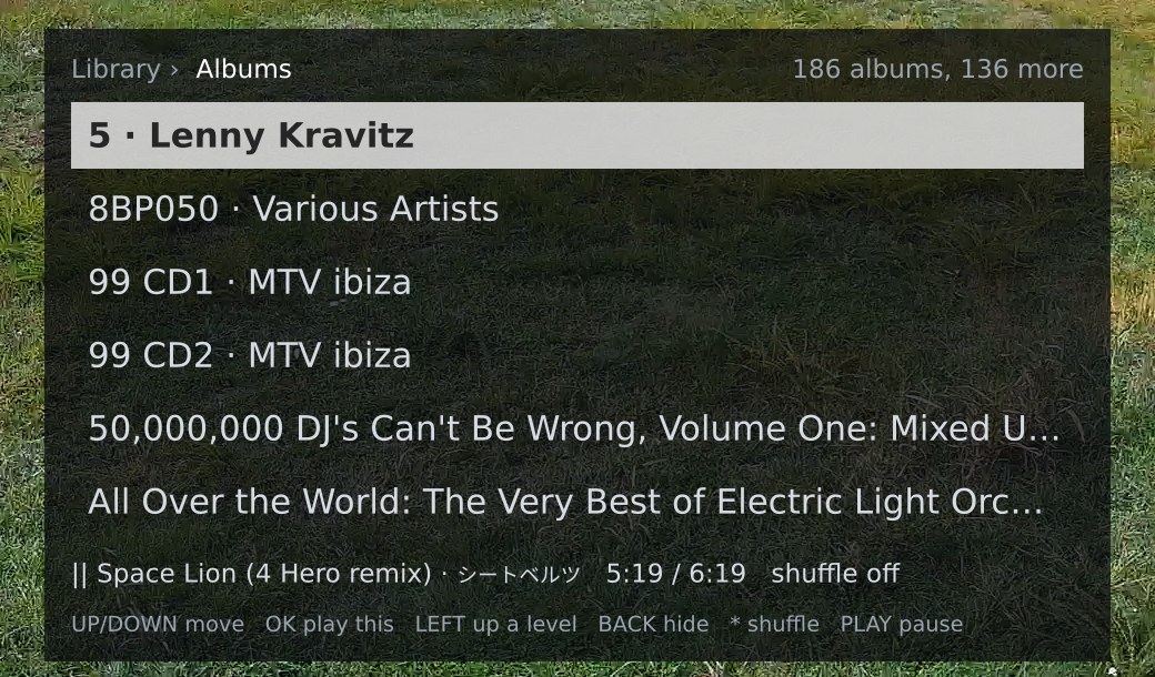 The Albums list: breadcrumb Library, Albums; the count 186 albums, 136 more; six rows of album and artist names with the first row focused; the now-playing strip and key hints
